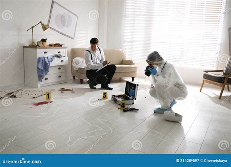 Investigators Working at Crime Scene in Living Room Stock Image - Image ...