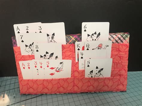 playing cards are placed on top of each other to make a card holder for ...