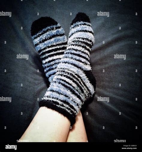 Cozy-looking feet, in warm, fluffy socks Stock Photo - Alamy