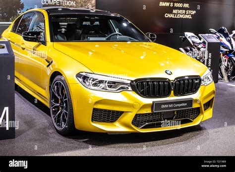 Geneva, Switzerland, March 05, 2019: metallic yellow BMW M5 Sedan ...