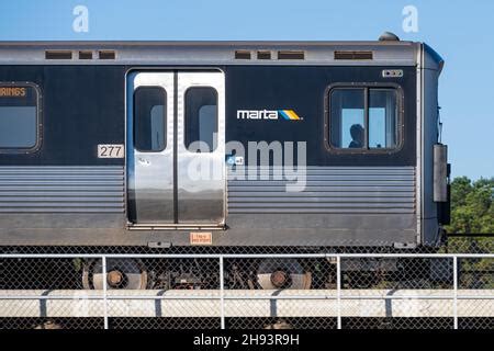 A MARTA (Metropolitan Atlanta Rapid Transit Authority) train passes on the railroad track behind ...