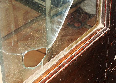 Bullet-shattered glass | This hole in a pane of glass behind… | Flickr