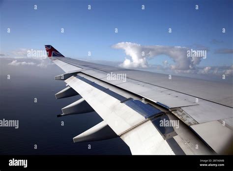 Boeing 747-400 (744) in flight view of Wing Through Aeroplane Window Stock Photo - Alamy