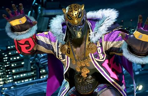 Masked Muta — Okada wears King’s “Rainmaker” costume from Tekken...