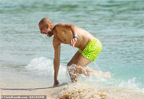 Feeling the chill, Pep?! Manchester City boss Guardiola enjoys a well-earned family holiday in ...