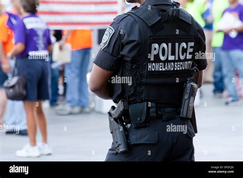 US Homeland Security (Federal Protective Service) policeman monitoring ...