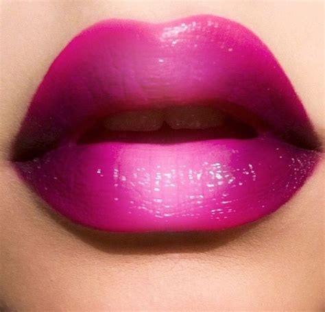 a woman's lips with bright pink lipstick