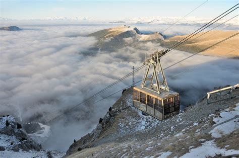 Ariel view of a cable car on the side of Mount Seceda in The Dolomites, which are part of the ...