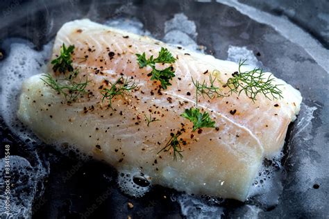 Pangasius fillet with spices and vegetables Stock Photo | Adobe Stock