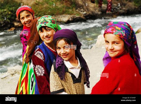 Tajikistan, Penjakent, group of girls in traditional dress by the river Stock Photo - Alamy