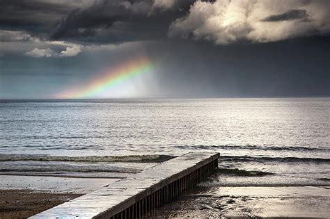 A Rainbow Shining In The Storm Clouds Photograph by John Short / Design Pics | Fine Art America