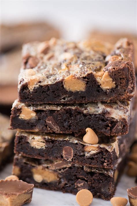 close up shot of reese's magic bars with pieces of reese's and chocolate chips | Milk recipes ...