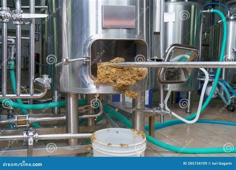 The Process of Cleaning Up Beer Production Waste at the Brewery from Beer Brewing. Background ...