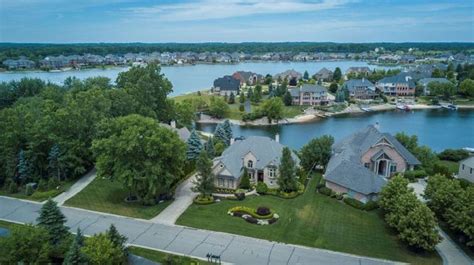 Lakeside Michigan home has private beach, outdoor kitchen, in-ground ...