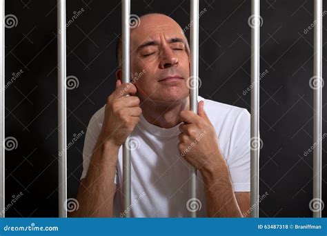 Desperate and Sad Man Behind Bars Stock Photo - Image of jail, bars ...