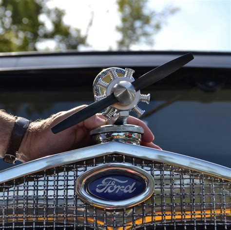 Pincher Creek Voice: Radiator caps enhance antique Ford aesthetics