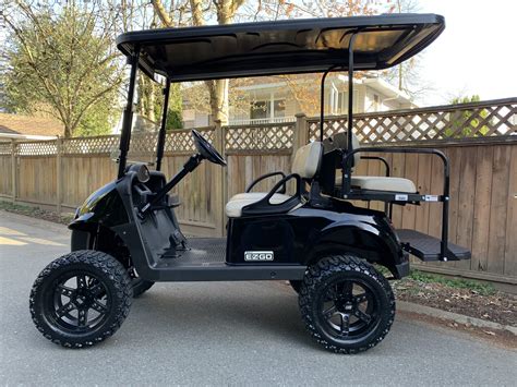 Black Lifted EZGO RXV, long roof and Lithium Battery - Big Thunder Golf Carts