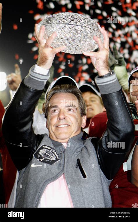 Alabama head Coach Nick Saban hoists the National Championship Trophy ...