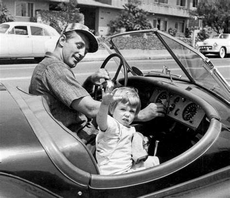 Lady Be Good: Robert Mitchum with his daughter Trini, 1956