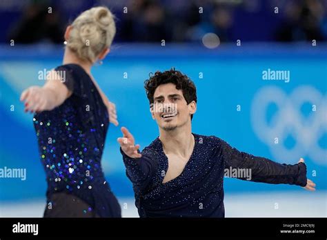 Piper Gilles and Paul Poirier, of Canada, compete in the team ice dance program during the ...