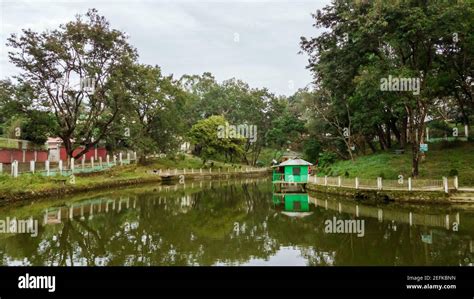 Haflong, Assam, India - January 2018: Reflections of trees in the ...