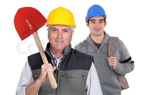 Experienced tradesman standing with apprentice | Stock image | Colourbox