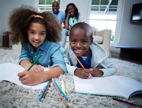 Premium Photo | Children doing their homework with parents