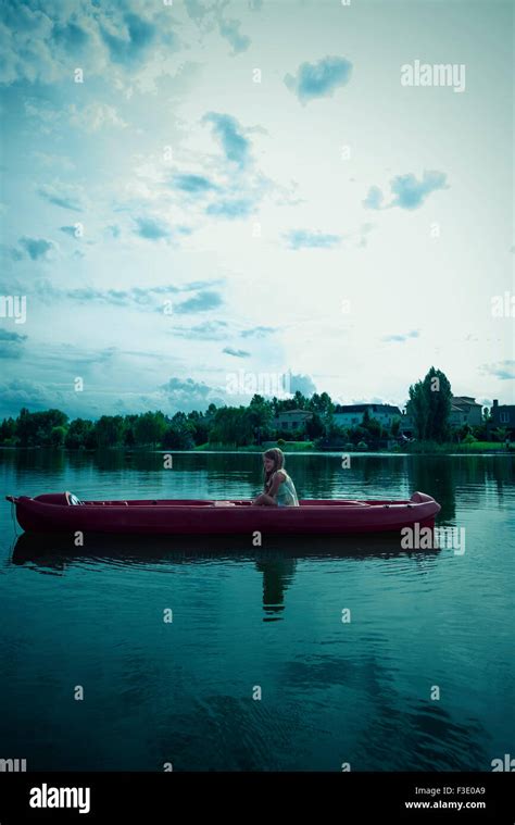 Girl kayaking on lake Stock Photo - Alamy