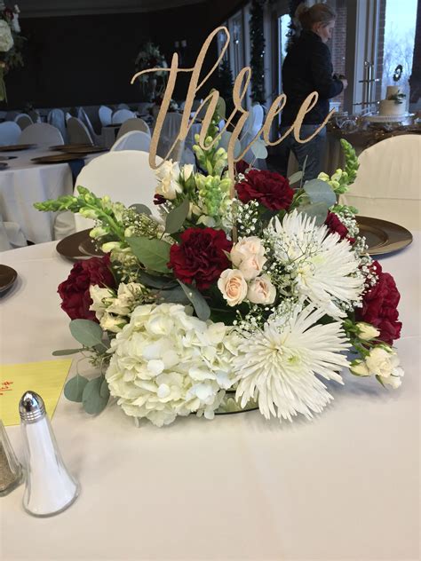 Centerpiece with burgundy carnations, white spider mums, cream spray roses, snap… | Wedding ...