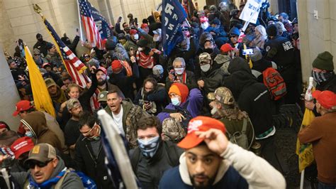 Capitol Officer Photographed In MAGA Hat Says It Was Ruse To Rescue Police | Complex