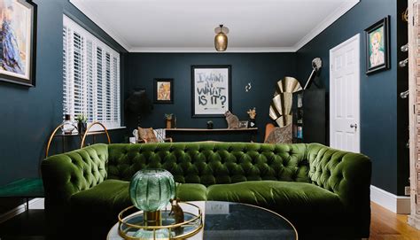 A dramatic but cosy dark blue, green & gold living room