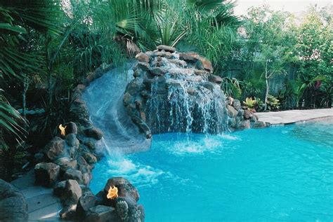 waterfall pool slide | Pool waterfall, Cool pools, Pool landscaping