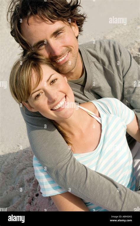 couple smiling on the beach Stock Photo - Alamy