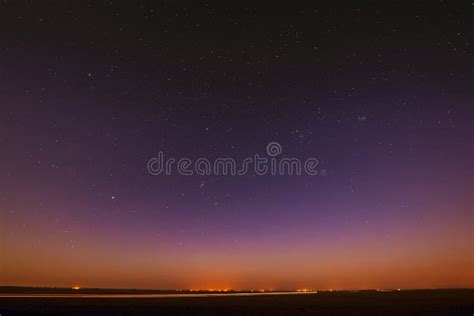 Night Starry Sky Over Yellow Sunset or Sunrise Lights. Night Glowing Stock Image - Image of ...