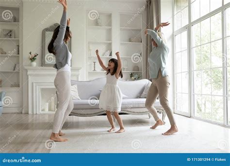 Happy Three Generations of Women Dancing in Living Room Stock Photo - Image of mother, amusement ...