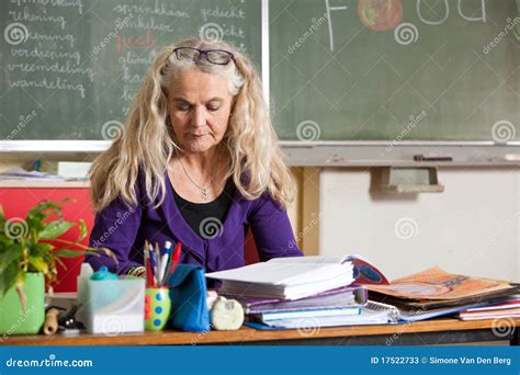 Teacher behind her desk stock image. Image of woman, pretty - 17522733