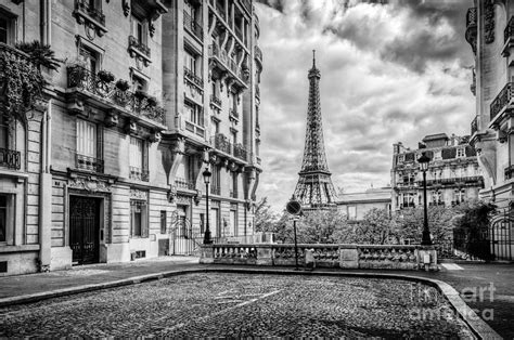 Eiffel Tower seen from the street in Paris, France. Black and white ...