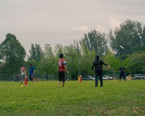 People Playing Frisbee Together at the Taman Tasik Cempaka Park ...