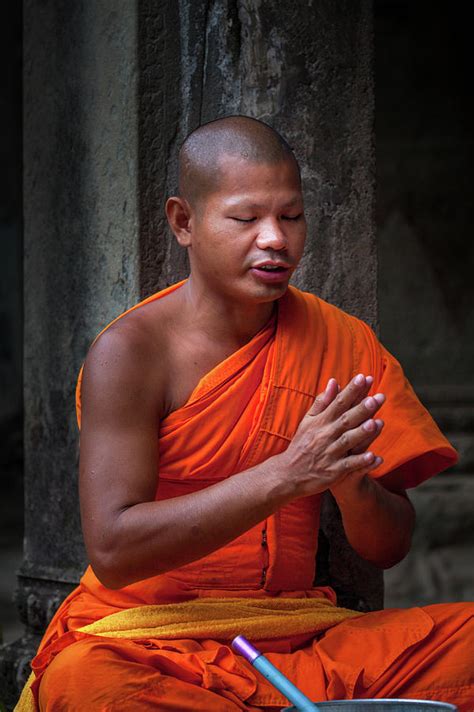Buddhist Monk Praying Photograph by Art Phaneuf - Pixels