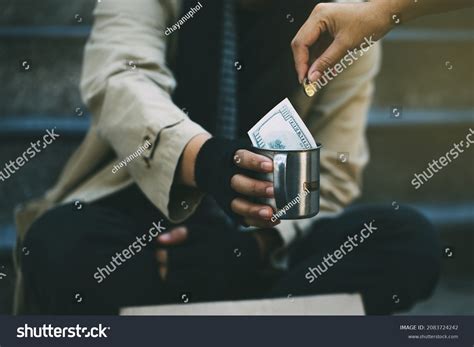 People Hand Giving Money Poor Homeless Foto Stok 2083724242 | Shutterstock