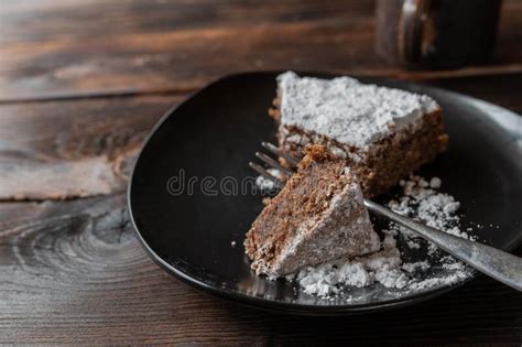 Slice of Chocolate Cake on a Brown Plate. Traditional Italian Torta Caprese Stock Photo - Image ...