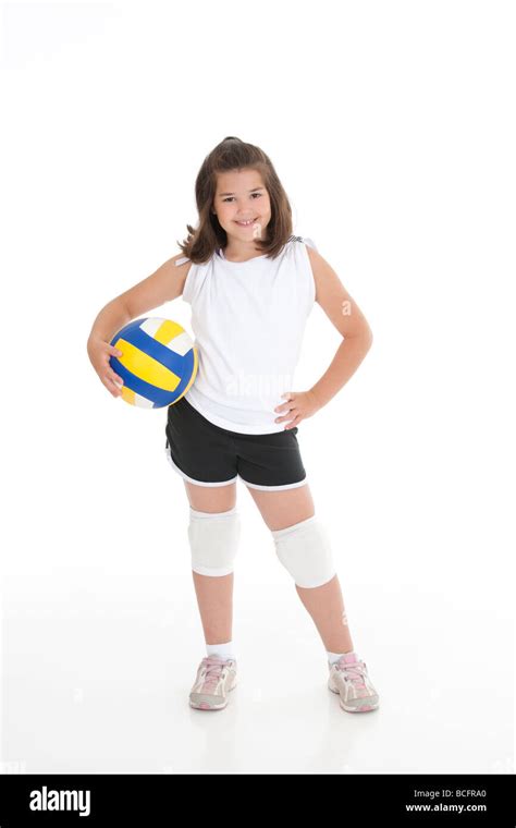 Portrait of a cute eight year old girl in volleyball outfit Stock Photo - Alamy