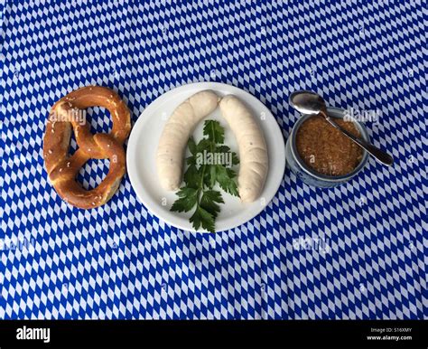 Weisswurst and pretzel for traditional breakfast in Bavaria, Germany, Europe Stock Photo - Alamy