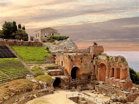 Greek ruins of the Temple of Concord and Theater of Taormina in Sicily ...