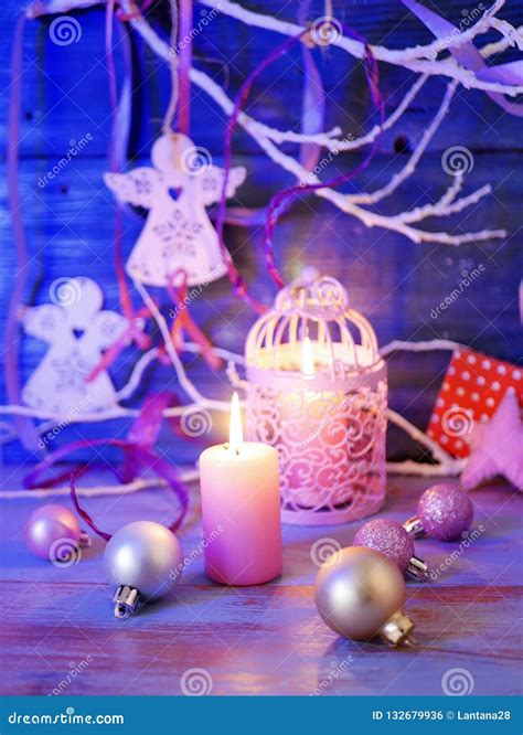 Lighted Candles, Decorative Lights, Balls, Christmas Decor on a Wooden Table, Wooden Background ...