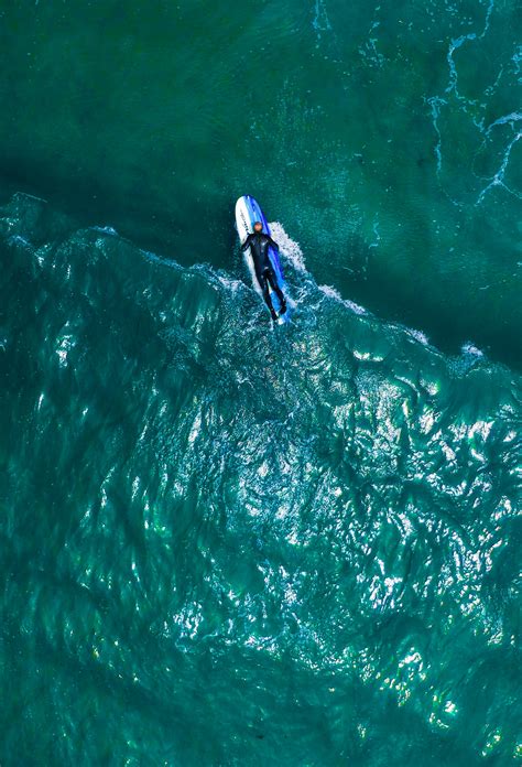 aerial-view-of-a-person-on-a-surfboard | Pixeor – Large Collection of ...