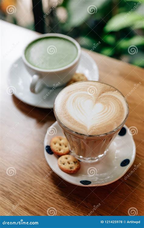 Latte Art Heart Shape and Green Tea Latte Served on Wooden Table ...