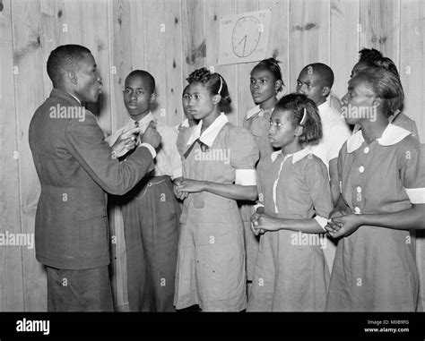 African American School choir led by Robert Pierce, school principal. They won state ...