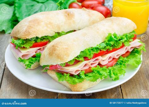 Ciabatta Bread Sandwiches With Ham And Cheese On The White Plate Stock ...