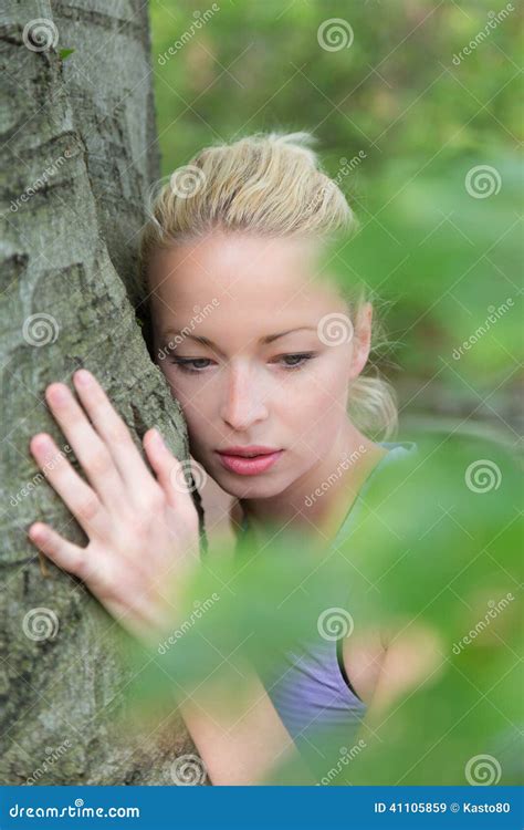 Young Woman Hugging a Tree. Stock Image - Image of listen, calm: 41105859